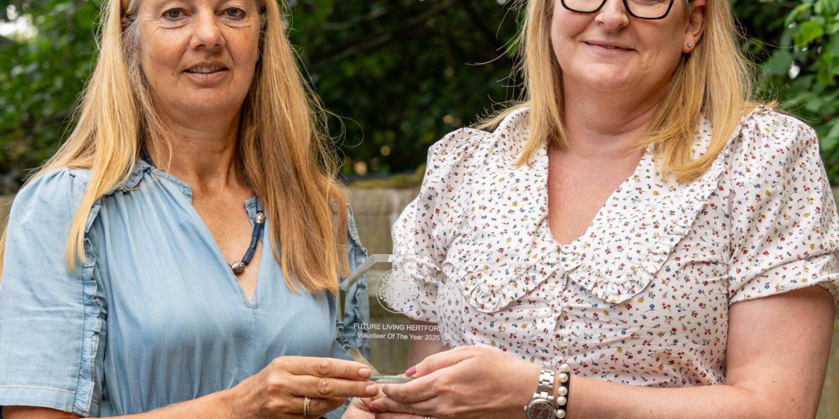Suzy Harvey - Chair presenting Placement Counsellor, Claire Kneller with her award