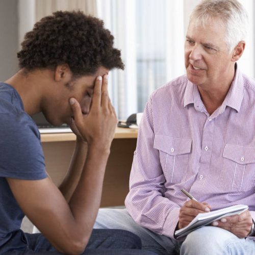 Young Man Having Counselling Session